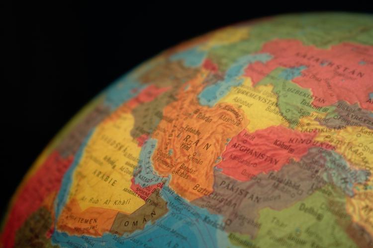 A globe centered on the nation of Iran
