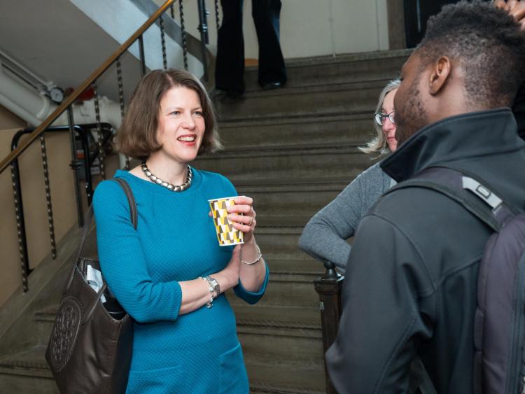 Graduate School Dean Ann Schmiesing chats with student at appreciation breakfast. Photo by Patrick Campbell.