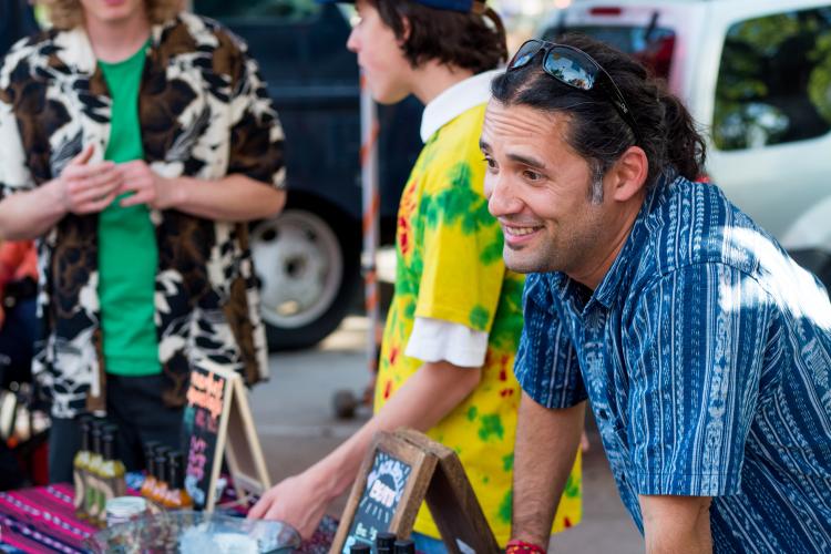 Juan talks to customers at Boulder Farmers Market