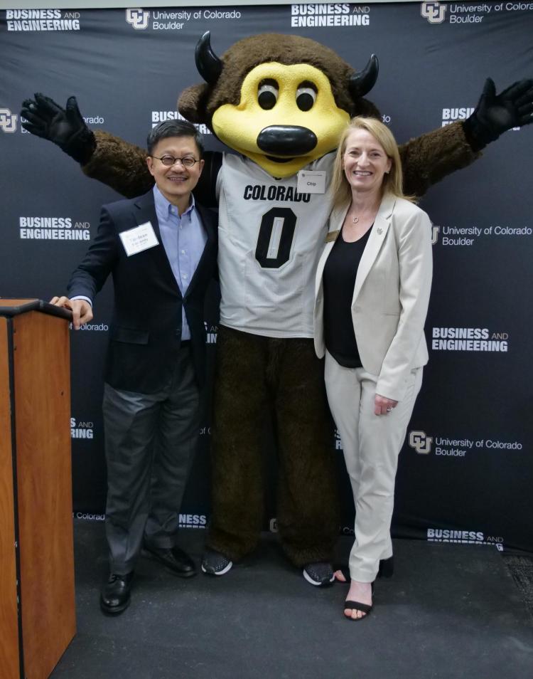 Donor Tandean Rustandy and Dean Sharon Matusik pose for photo with Chip