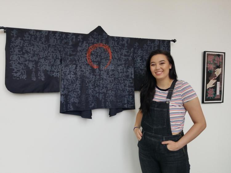 Haley Takahashi with one of the kimonos she made for the exhibit