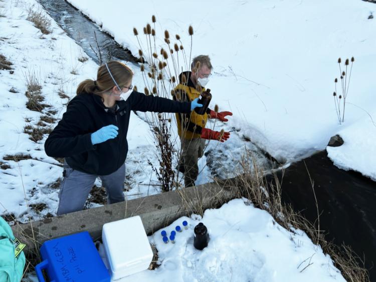 Researchers conduct water sampling.
