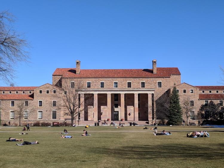 Students enjoy the warm weather at Norlin Quad. Photo by Patrick Campbell.