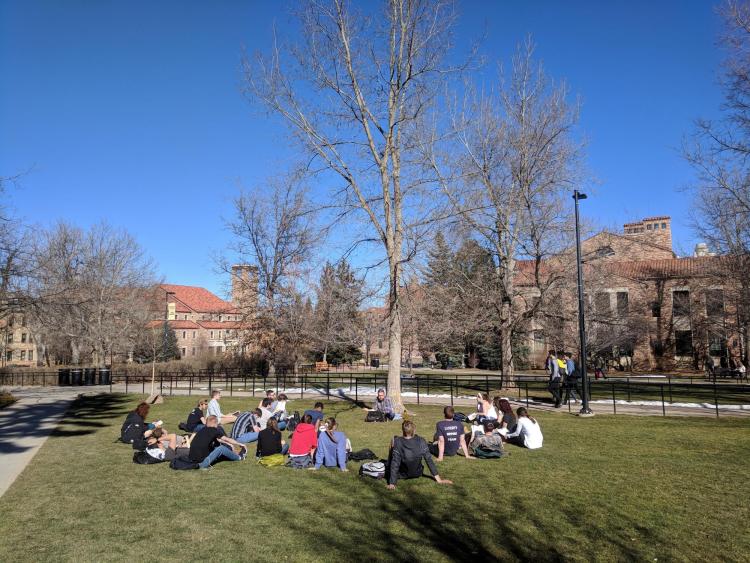 Students enjoy the warm weather at Norlin Quad. Photo by Patrick Campbell.