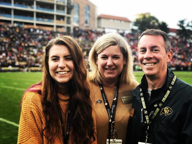 CU Boulder’s Dean of Engineering and Applied Science Bobby Braun, his wife Karen, and his daughter attend a CU football game in the fall of 2018.