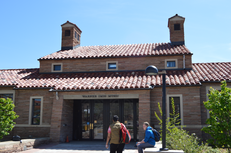 Students pass by Warner Imig Music Building
