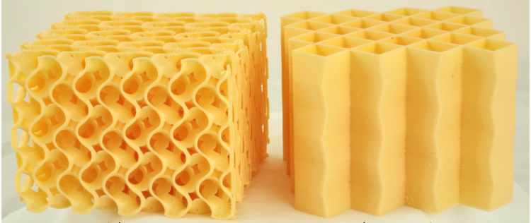 Two yellow bricks with different internal geometries sit side by side