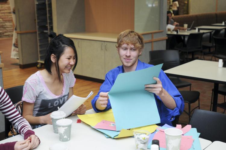 Students do crafts at International Coffee Hour