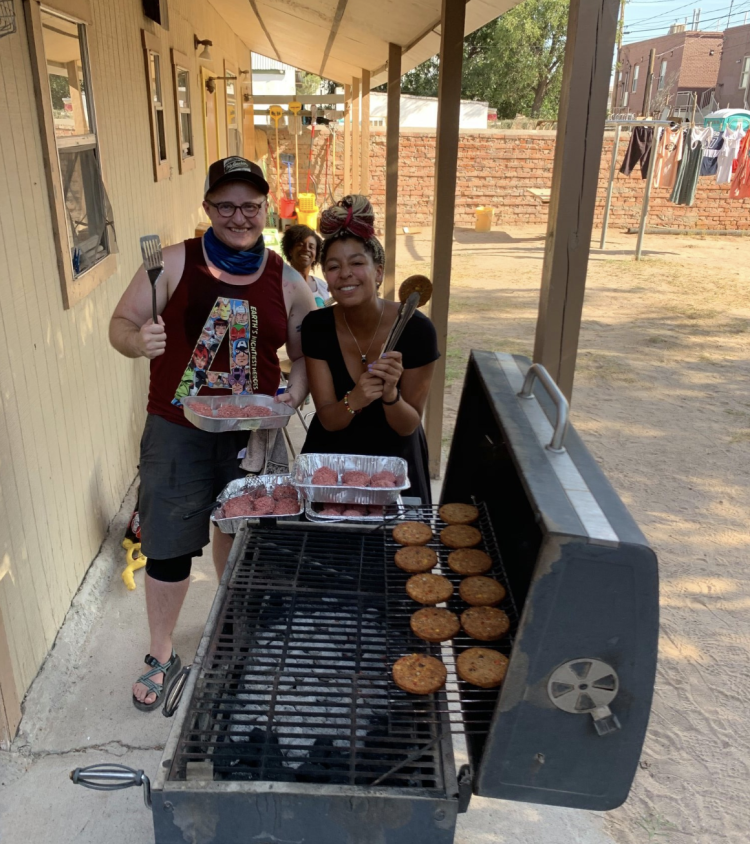 The INVST team grills burgers at Annunciation House