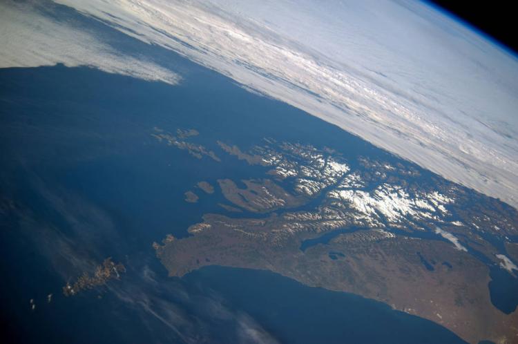 This panoramic image from Feb. 14, 2014, shows parts of Chile and Argentina from the International Space Station (ISS). Tierra del Fuego and Cape Horn are shown here, with the Atlantic Ocean in the foreground and the Pacific Ocean across the top of the image. (Photo provided by NASA)