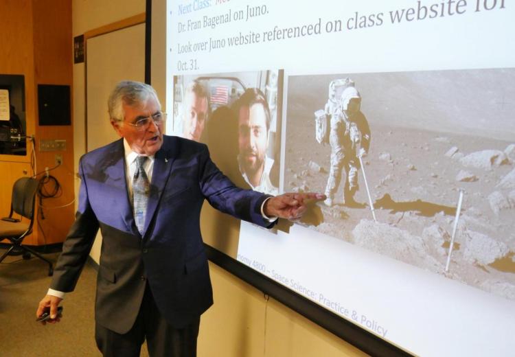 Harrison Schmitt talks to students on campus during a visit in 2018.