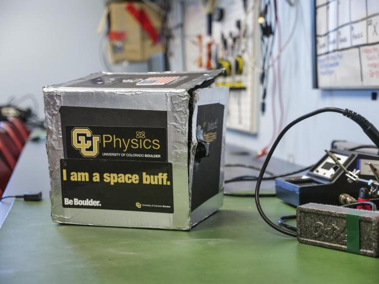 Stickers read: I am a space buff and CU Physics.