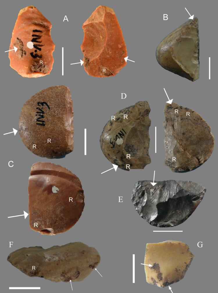 Flints bearing traces of pine resin. The letter "R" indicates the presence of visible resin, and the arrows point point to spots where researchers sampled materials for chemical analysis