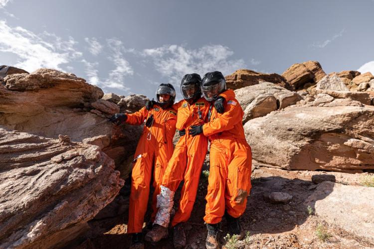Students tend to an injured crewmate (instructor Allie Anderson) during a simulation exercise at the “Medicine in Space” class in southern Utah.