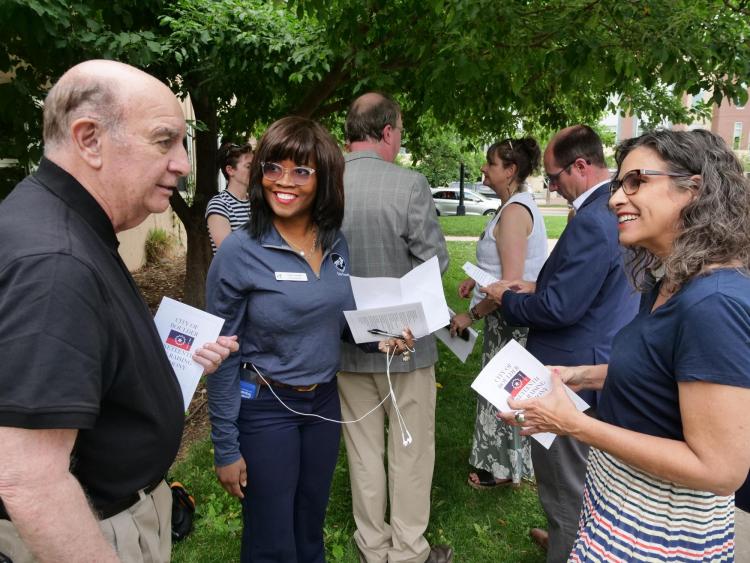 Chancellor Philip DiStefano, Councilwoman Junie Joseph and Senior Vice Chancellor Sonia DeLuca Fernández chat before a raising of the Juneteenth flag