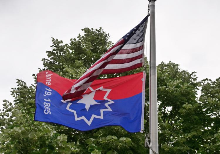Juneteenth Flag flies below the Stars and Stripes