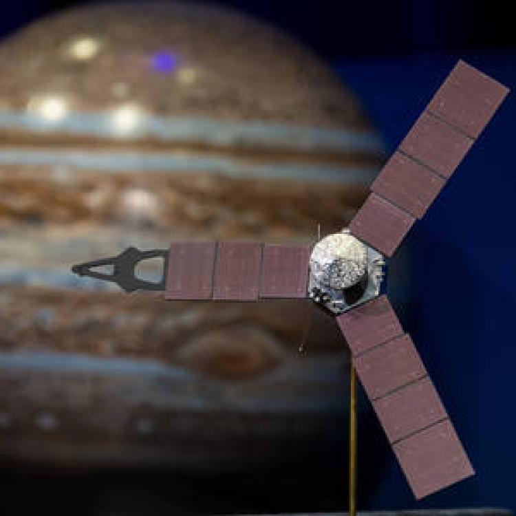 Juno spacecraft superimposed over image of Jupiter