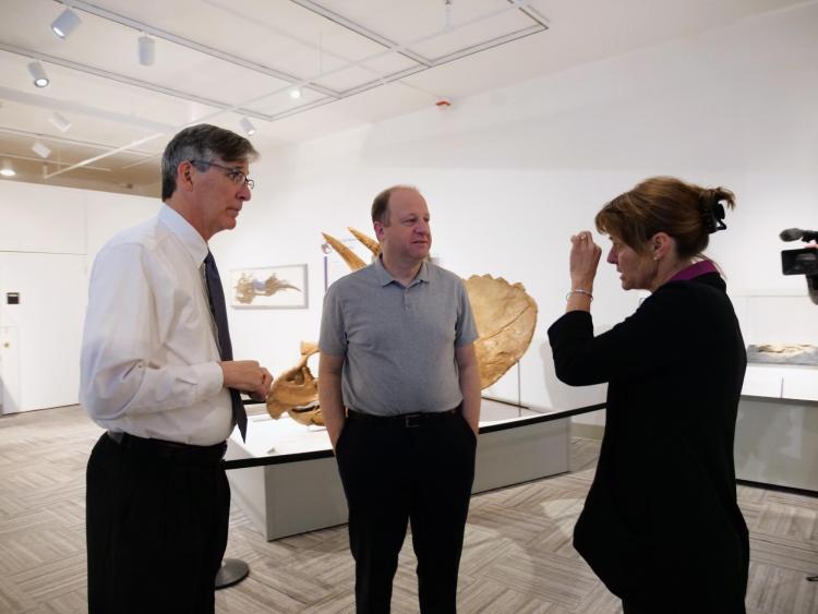 Patrick Kociolek stands with Gov. Jared Polis and Jaelyn Eberle
