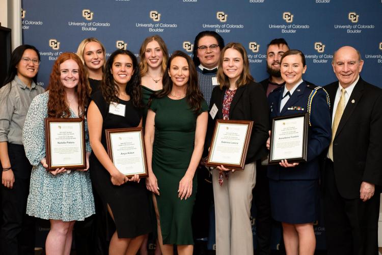 CU Boulder's Student Leaders of the Year pose for a photo with Molly Bloom and Chancellor Philip DiStefano