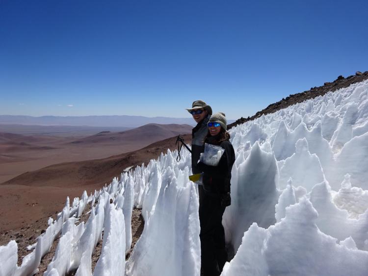 Lara Vimercati and John Darcy stand among nieves penitentes structures on Volcán Llullaillaco in Chile