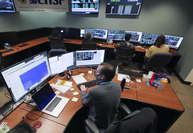 IXPE flight director Darren Osborne, foreground, oversees the missions operations center at LASP.