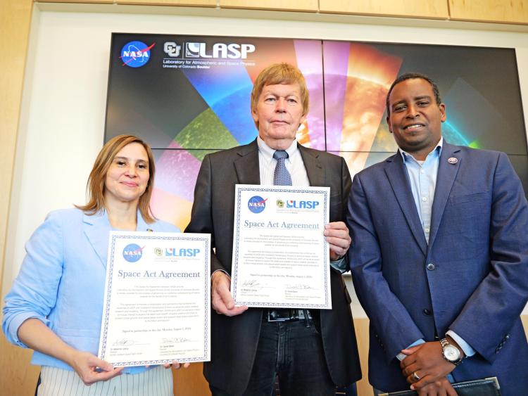 Goddard Space Center Director Makenzie Lystrup and LASP Director Dan Baker and Congressman Joe Neguse