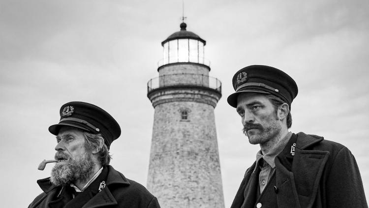 Black and white photo of Willem Dafoe and Robert Pattinson in The Lighthouse film