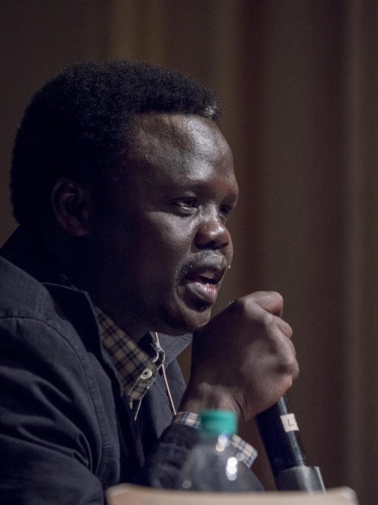 Valentino Achak Deng, former minister of education in South Sudan, tells his story as a lost boy. Photo by Glenn Asakawa.