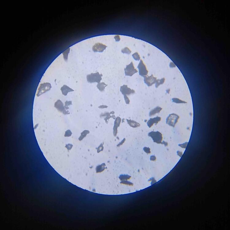 A close up video of jagged lunar "simulant" dust