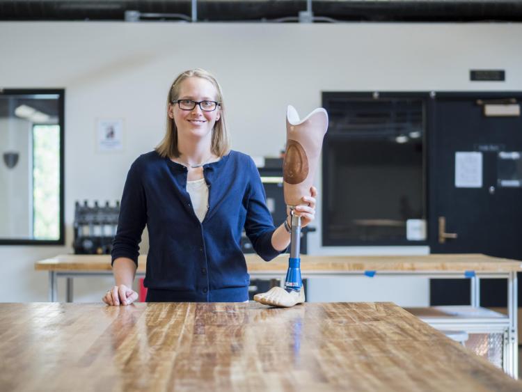 Madalyn Kern stands in the Idea Forge with a prosthetic leg