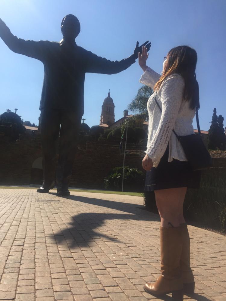 Student Connie Hernandez gives Nelson Mandela statue a high-five