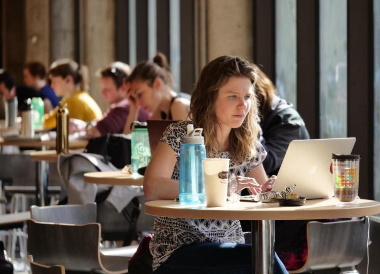 Students study in the Engineering and Applied Sciences lobby. Photo by Casey A. Cass.