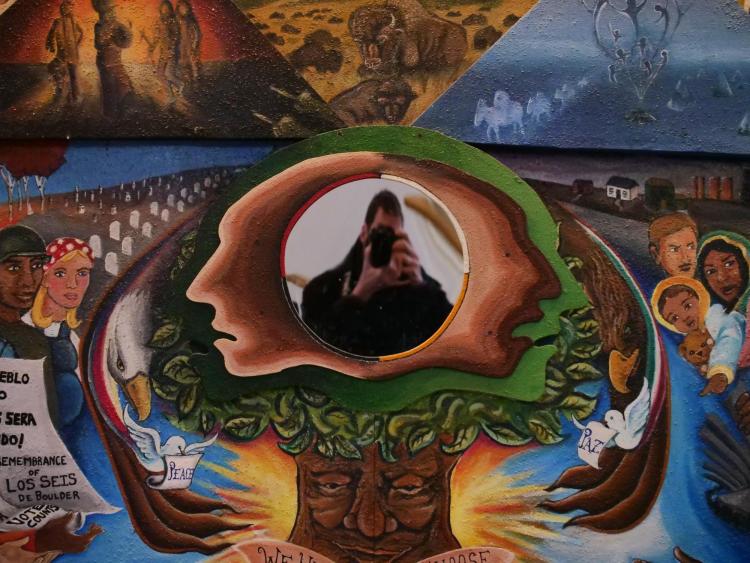 A self portrait on a mural in Norlin Library. Photo by Casey A. Cass.