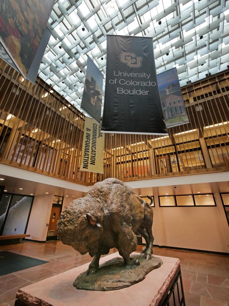 A sculpture of a buffalo titled "Ancient Way" by Sandy Scott stands in the atrium in Regent Administrative Center. Photo by Casey A. Cass.