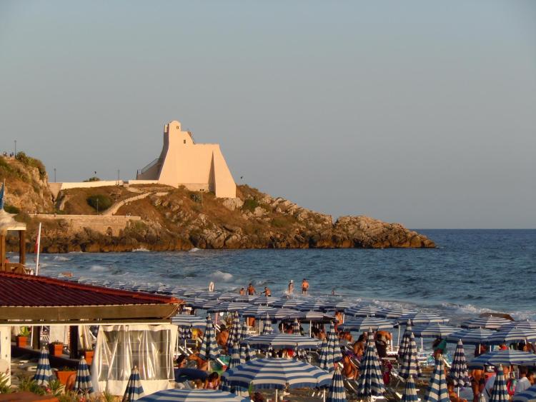 A few Homo sapiens families enjoy the beach in Sperlonga, Italy, not far from Grotta dei Moscerini.
