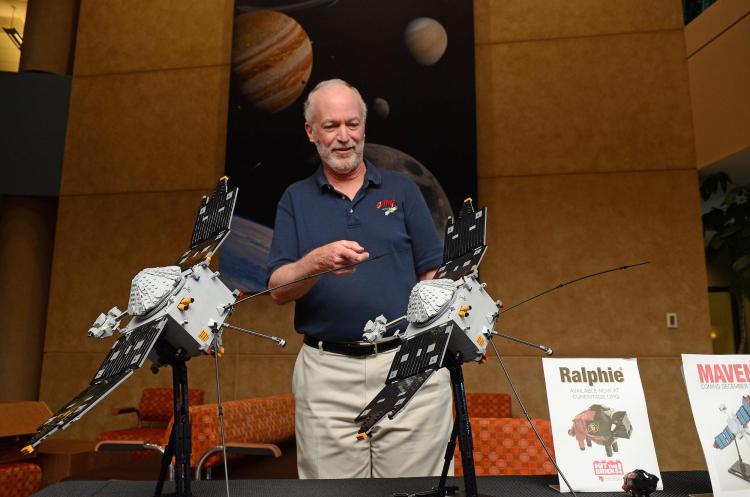 Bruce Jakosky looks at two Lego models of the MAVEN spacecraft
