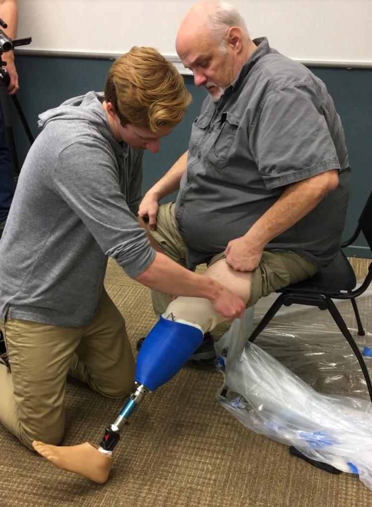 Max Armstrong performs prosthetic socket fitting