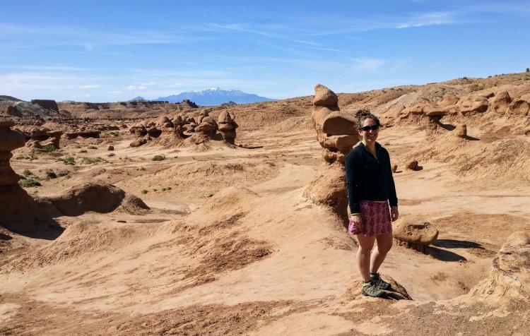 Lisa Mayhew hiking amid red rock formations