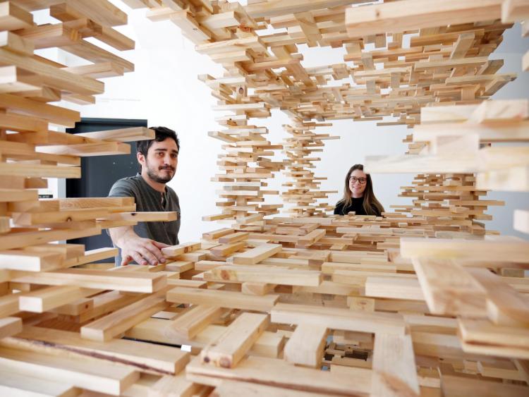 Undergraduates Haley Hyde and Matthew Vivirito with the Mobile Interdisciplinary Networking Exhibition (M.I.N.E.)