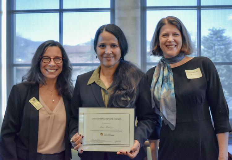 Awardee Mithi Mukherjee (center) with Vice Chancellor Michele Moses (left) and Vice Chancellor Ann Schmiesing (right)