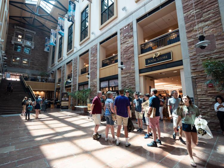 Students and families stand outside the CU Book Store.