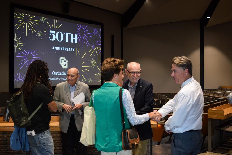 CU Boulder chancellor, provost and COO mingling with attendees