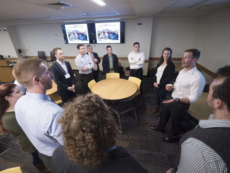 Evening MBA Class of 2020 students form a circle and introduce themselves to classmates during an ice-breaker exercise. Photo by Glenn Asakawa.
