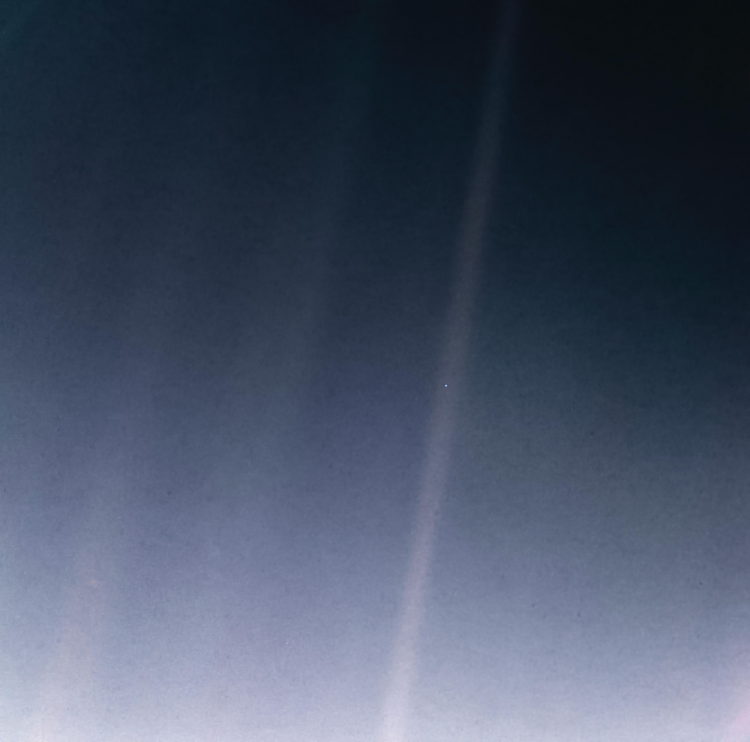 Image of space with a very small dot of light