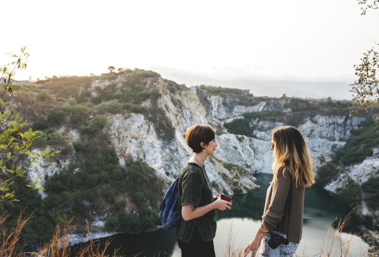 Friends chat during a hike