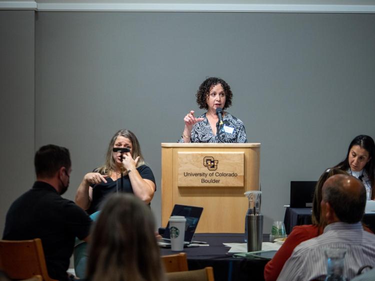 Lisa Flores speaks at the IDEA Council's public forum