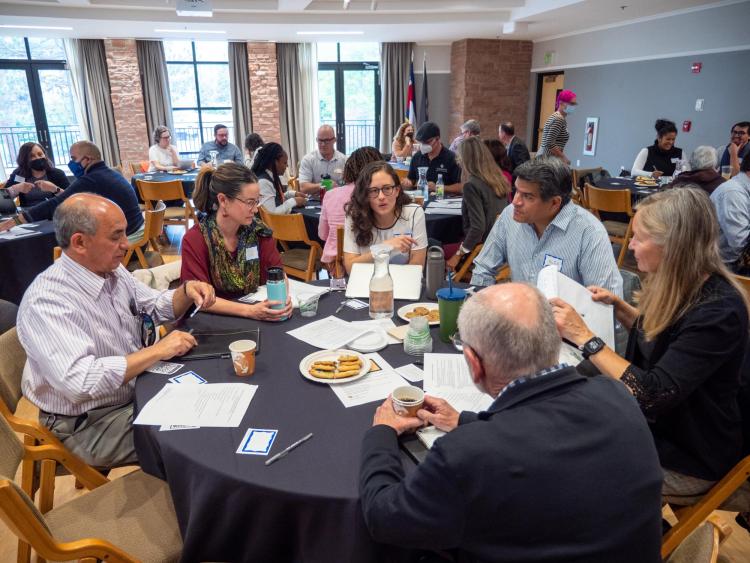 Staff and faculty members participate in group breakout sessions