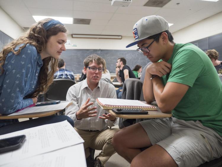 Hough interacts with students in the classroom
