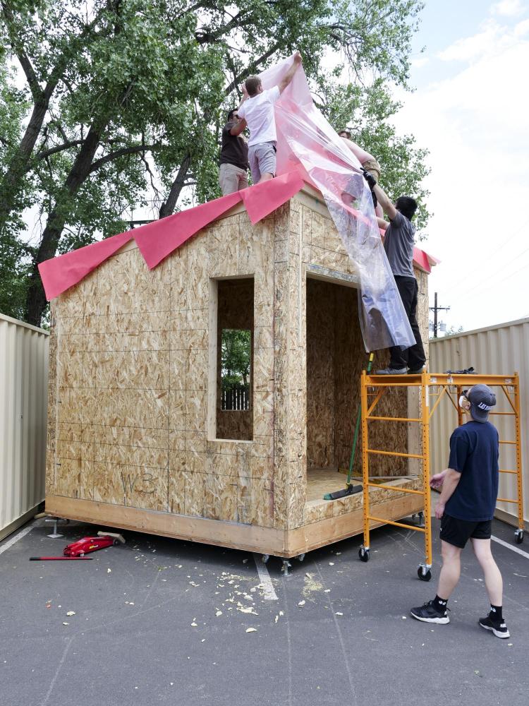 Students add materials to their outdoor pocket studio.
