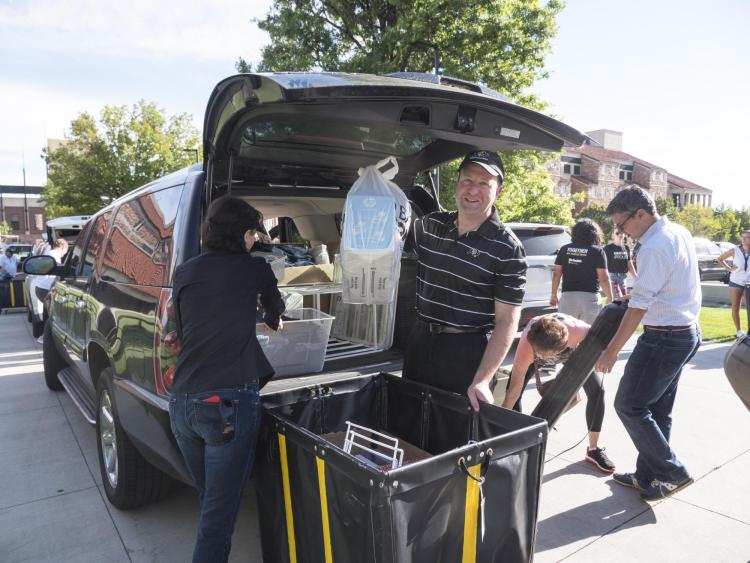 U.S. Rep. Jared Polis helping students move in the residence halls